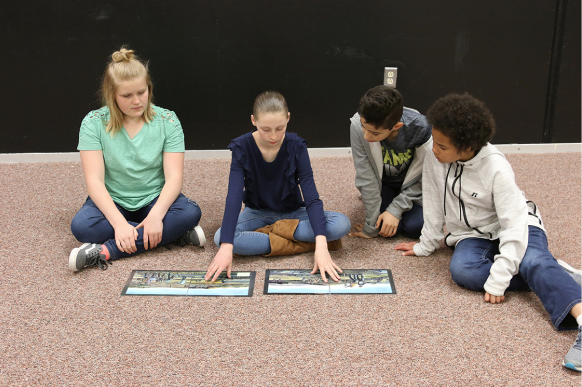Children sitting on the ground