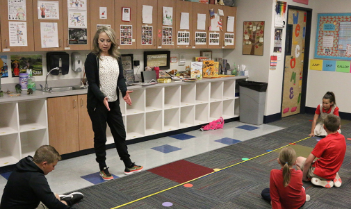 Teacher teaching a class in a classroom