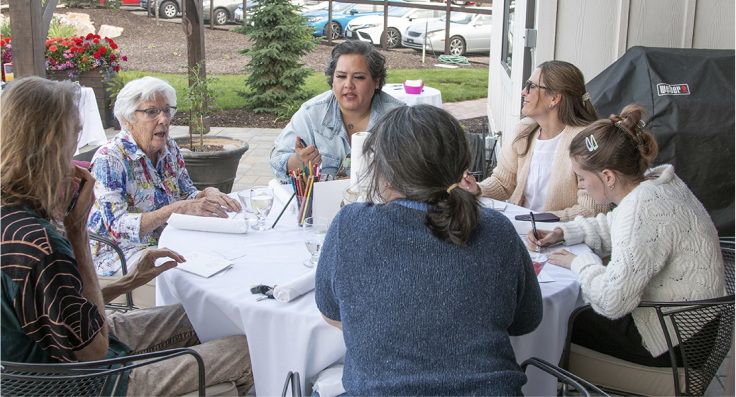 People around table in discussion