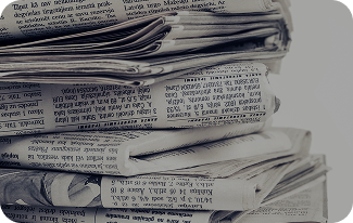 Newspapers stacked on top of each other