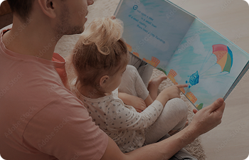 Father and daughter reading a book