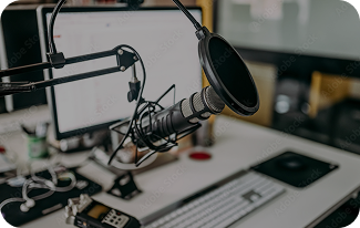 Podcast microphone and computer setup.