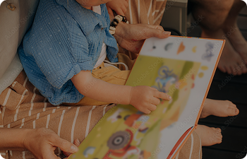 Parent and child reading a children's book