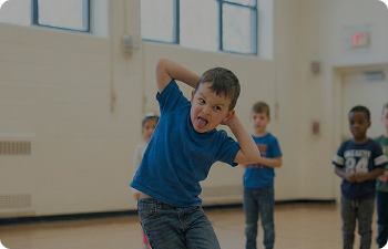 Child dancing and making a face